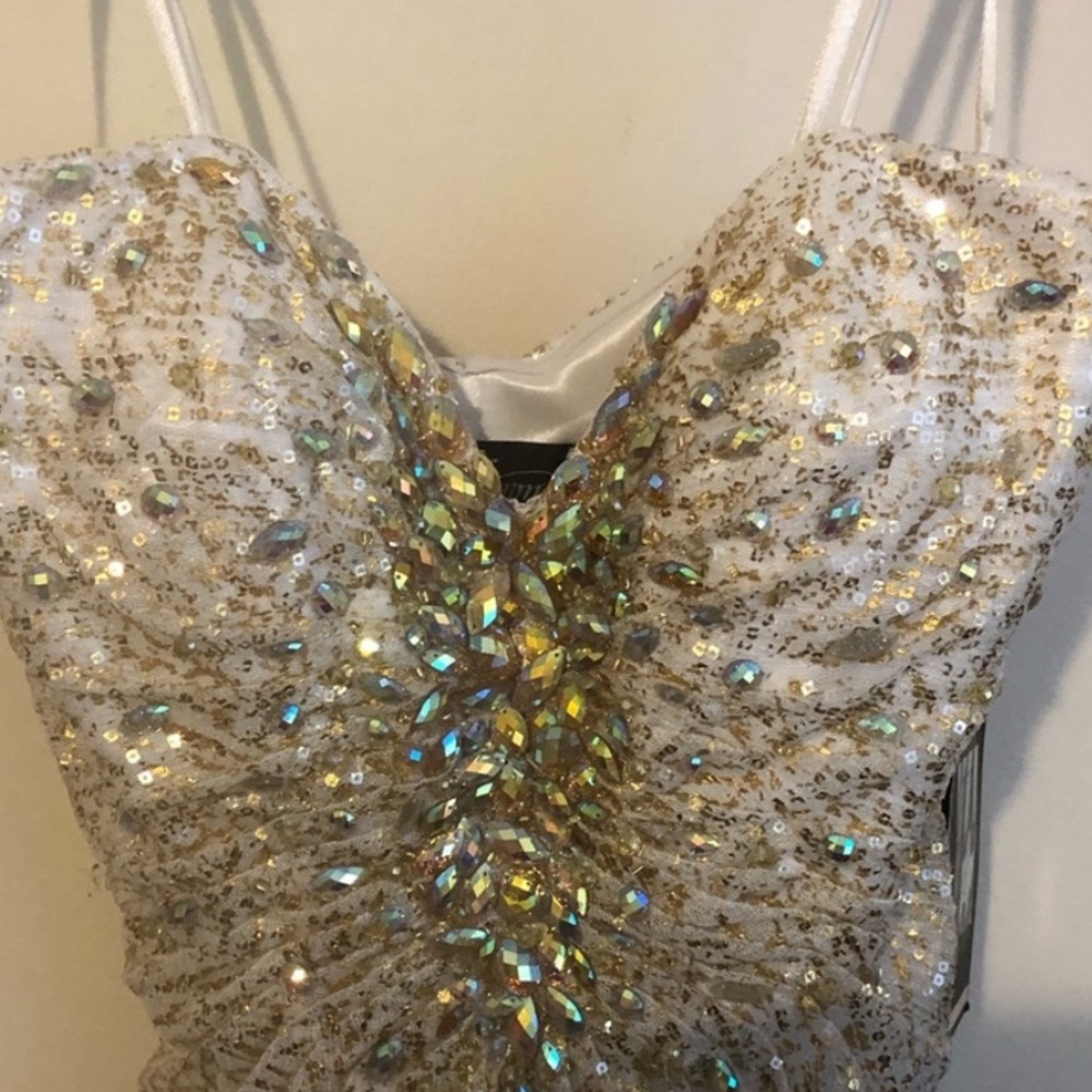 Gold dress and is strapless hangs beautifully